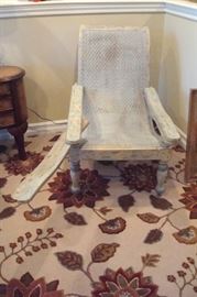 Aarhaus plantation chair with swivel arms.