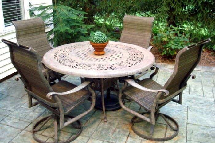 Heavy duty patio table and swivel chairs.