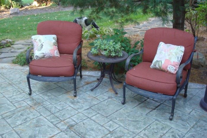 Pair patio chairs with cushions and table.