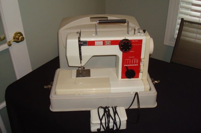 Sewing machine with case.