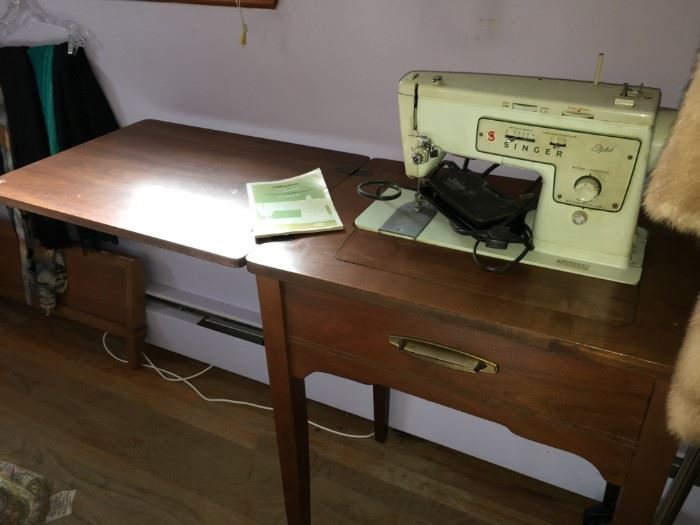 Singer sewing machine in storaway cabinet