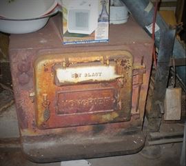OLD WOOD BURNING STOVE THAT HEATED THE POLE BARN.  COMES WITH THE CHIMNEY PIPE