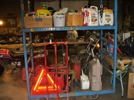 LOOK AT THE TABLES AND RACKS JUST PILED AS FAR BACK IN THE POLE BARN AS YOU CAN SEE. ROWS OF THESE THINGS.