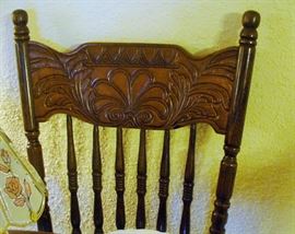 A CLOSE UP OF THE DINING ROOM CHAIRS