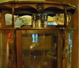 GLASSES AND DEPRESSION GLASS PITCHER ATOP CHINA CABINEY