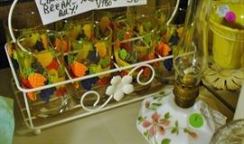 A PERFECT SET OF 8 GLASSES IN ORIGINAL WIRE RACK FROM THE 1930/1940 ERA.  A COLLECTOR'S DREAM FIND.  LITTLE OLD FLORAL OIL LAMP TOO