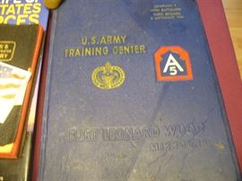 MILITARY BOOK ON THE TABLE OF OTHER MILITARY ITEMS RIGHT NEXT TO CHECK OUT TABLE