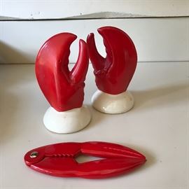 Vintage Shawnee lobster claw salt + pepper shakers along with a lobster cracker.