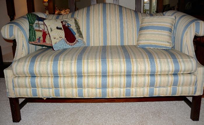 Camelback sofa with rolled arms