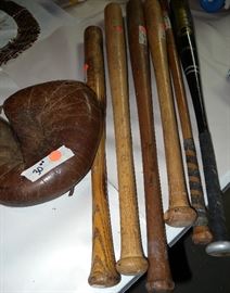 Vintage bats and catcher's mitt. Other sports equipment.