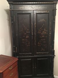 Beautiful Armoire with Handpainted Asian Scenery. Mirrors line the interior of the top portion that is lighted also.