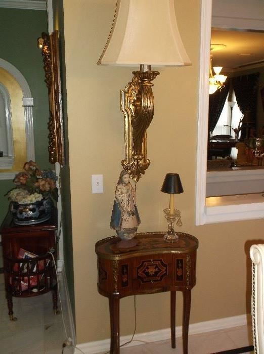 Wall mounted gold tone lamp and French side table