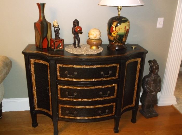 Bow front three drawer and two door black chest w/gold trim
