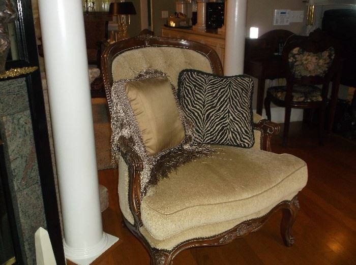 Large side chair w/ornately carved legs, arms, and trim