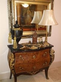 One of two black marble top bombay chests and gorgeous framed mirror