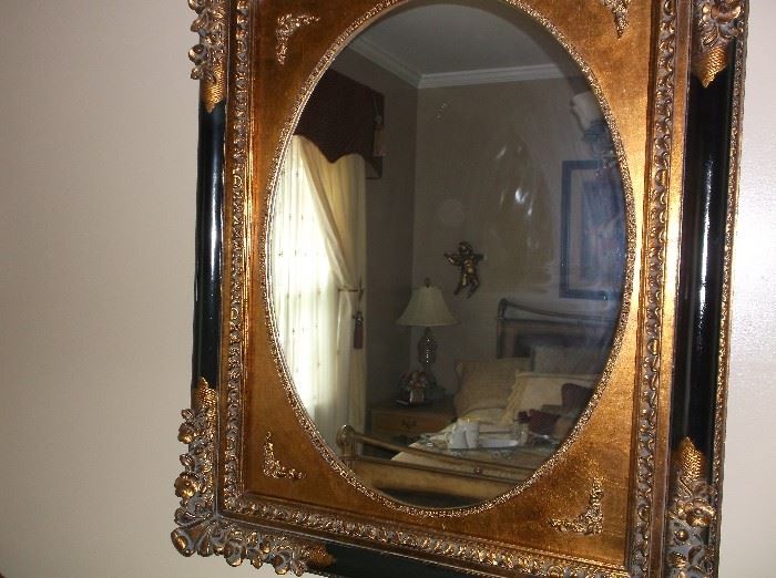 Very large oval framed mirror