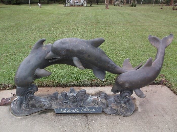 Three jumping dolphins bronze statue "Soulmates at Play" by Bustemonte