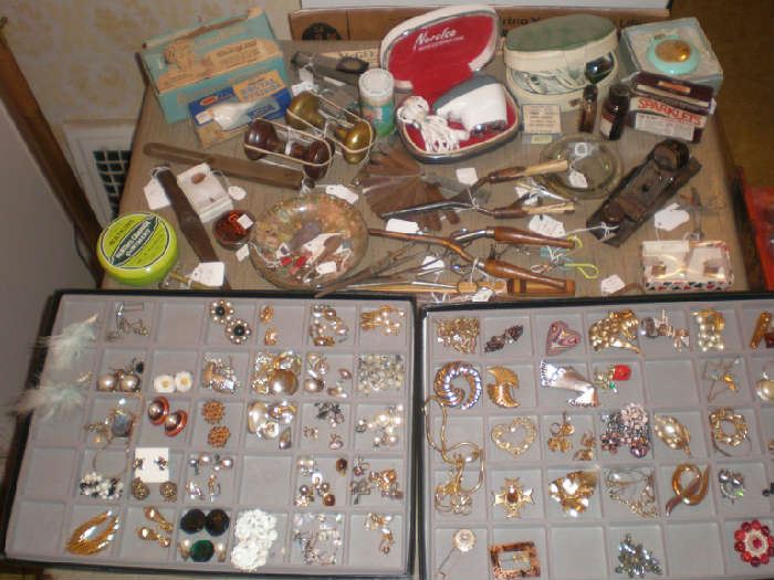 Costume jewelry, curlig irons, razlors, and lots of other small items.