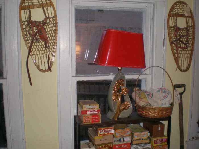 Snow shoes, MCM grey and red lamp with gold, cigar boxes.