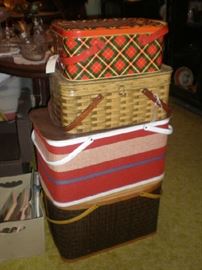 Woven and metal picnic baskets.