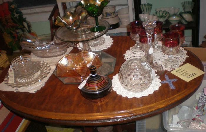 Oval library table, kings crown goblets, american fostoria, pedestal cake plate, carnival glass.