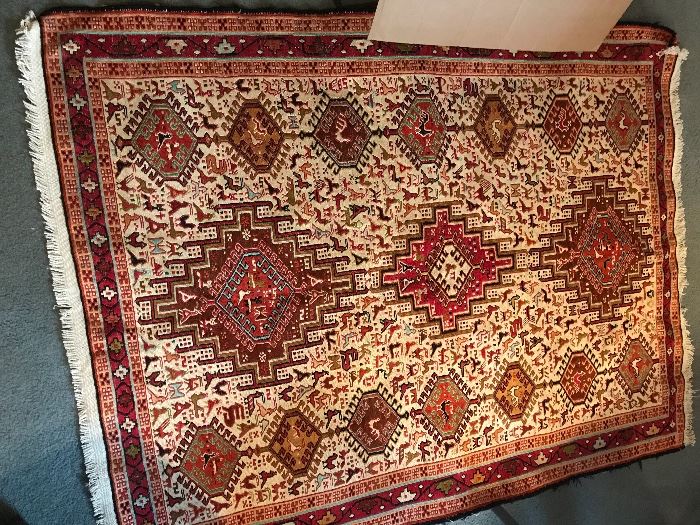Pair of matching hand knitted silk and wool blend rugs purchased in Pakistan. 