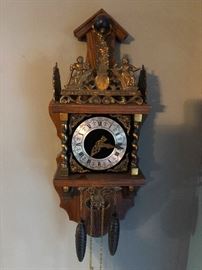 Vintage weight driven clock Atlas has world on shoulders