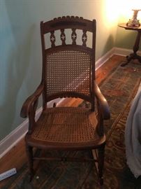 Vintage caned Lincoln rocking chair rocker