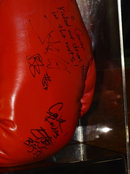 Pair of Everlast boxing gloves with case signed by Texas band Bowling For Soup. Originally presented as a gift from the band after a 2007 SXSW filming  of their single "Almost" at the Bat Bar for services rendered that resulted in the recipient being punched by a drunken drum tech who was disrupting filming. 
    $595.00     Contact for purchase or more information