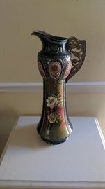 Vase made in Austria. It has several cracks and chips. This could be used for the person that likes to make things with ceramics. $3.00