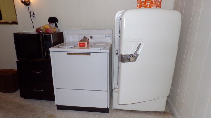 Stove, Cabinet, Microwave, Frigidaire Refrigerator, still working in Basement