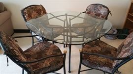 really nice dining set or patio set - beveled plate glass top table and cushions can be changed out...but this set is handsome!