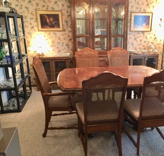 Quality dining room table with nice upholstered chairs and hutch 