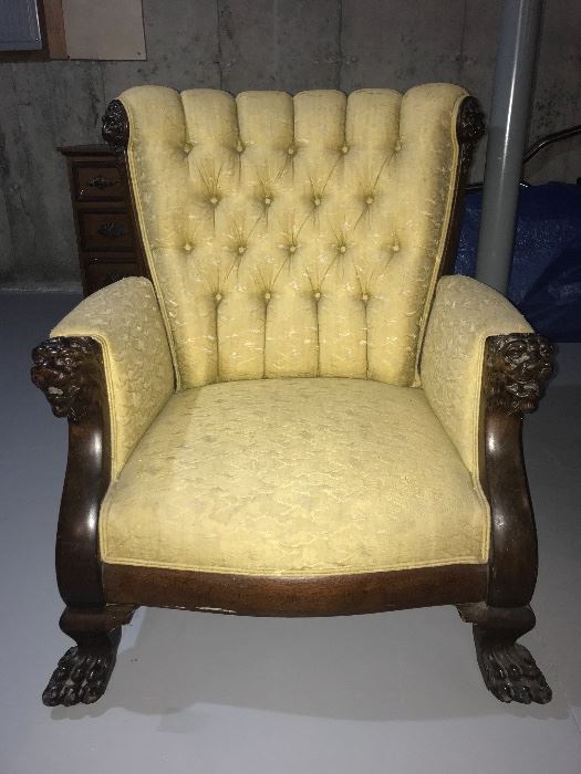 Antique Karen chair with lion’s head.