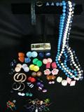 Lot #52: Colorful Costume Jewelry Lot Inc. 4 Necklaces, Rose Pendant w/Matching Pin, 2 Rings (1 w/Changeable Bead), 2 Bracelets & Over 20 Pair of Earrings.
