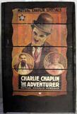 Lot#173:  Segmented "Charlie Chaplin" Poster "The Adventurer" Mutual Chaplin Specials Mounted On Framed Slats Of Dark Finish Wood, Hardware For Hanging, 36"T x 24"W.