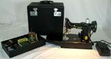 Lot #209:  Singer Feather Weight Electric Portable Sewing Machine Complete w/Original Case, Instruction Manual, Oil Container, Tools, Extra Feet, Foot Pedal & Electric Cord, Works, Excellent Condition.
