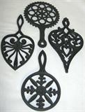 Lot #47:  Four Shown of the Twelve Black Cast Trivets in Lot, 5" to 11.25"L.