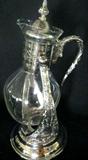 Lot #245: Silverplated Hostess Lot, Inc. Tilting Coffee Carafe, Eleven Cups and Punch Ladle.