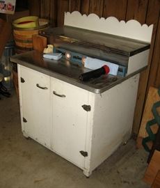 Cabinet on rolling wheels with stainless covered top