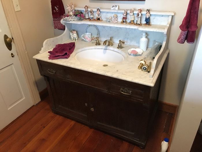 This antique vanity is for sale.  Must be able to cut off water and detach yourself.