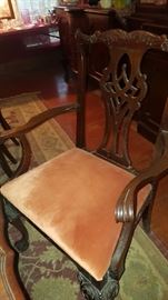 Beautiful antique captain chair that matches the dining room table.