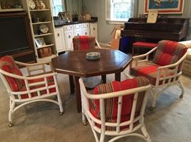 Octagonal game table with 4 vintage bamboo chairs.