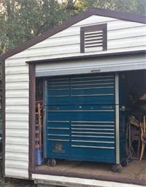 Detail on Janus roll-up door on side of 12x30 shed.