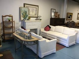 Henredon winter-white sofas. Contemporary glass top sofa table.