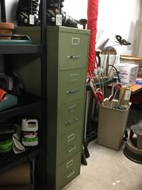 Green vertical file cabinet. 