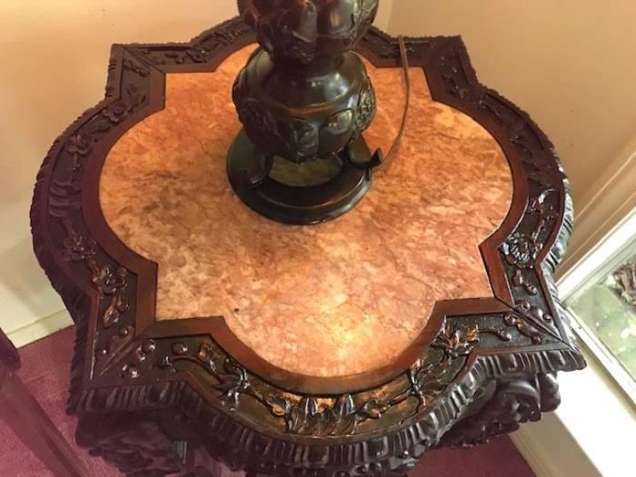 Oriental pedestal with pink inserted top, one shelve. Highly carved teakwood. 