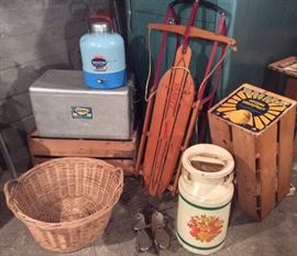Vintage Cronco aluminum cooler, JC Higgins Sportsman's jug, Yankee Clipper wooden sled, old Sunkist grapefruit crate, painted milk can, old metal roller skates