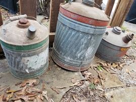 Three vintage gas cans