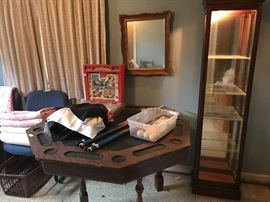 Small lighted curio cabinet and game table